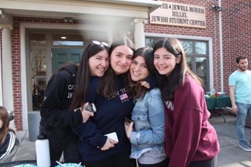 Hackman poses with three female friends.