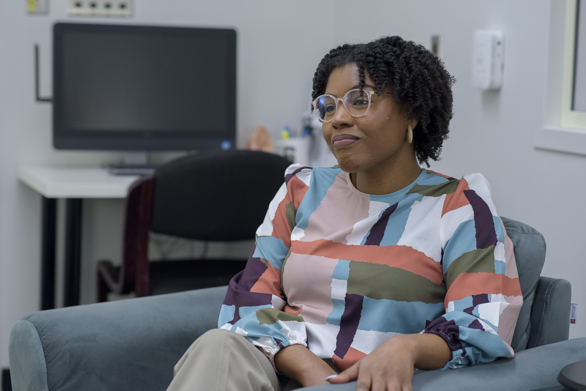 Deja Young sits in the clinic.